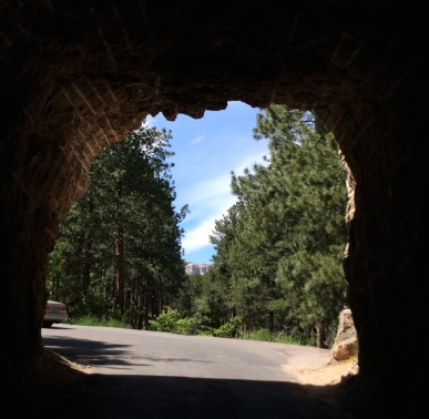 Surprise! A view of Mount Rushmore framed by a tunnel on Needles Highway.